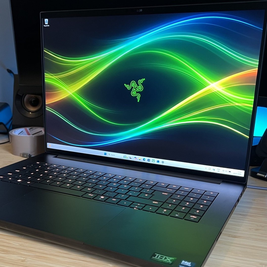 Razer Blade 18 gaming laptop on a wooden desk