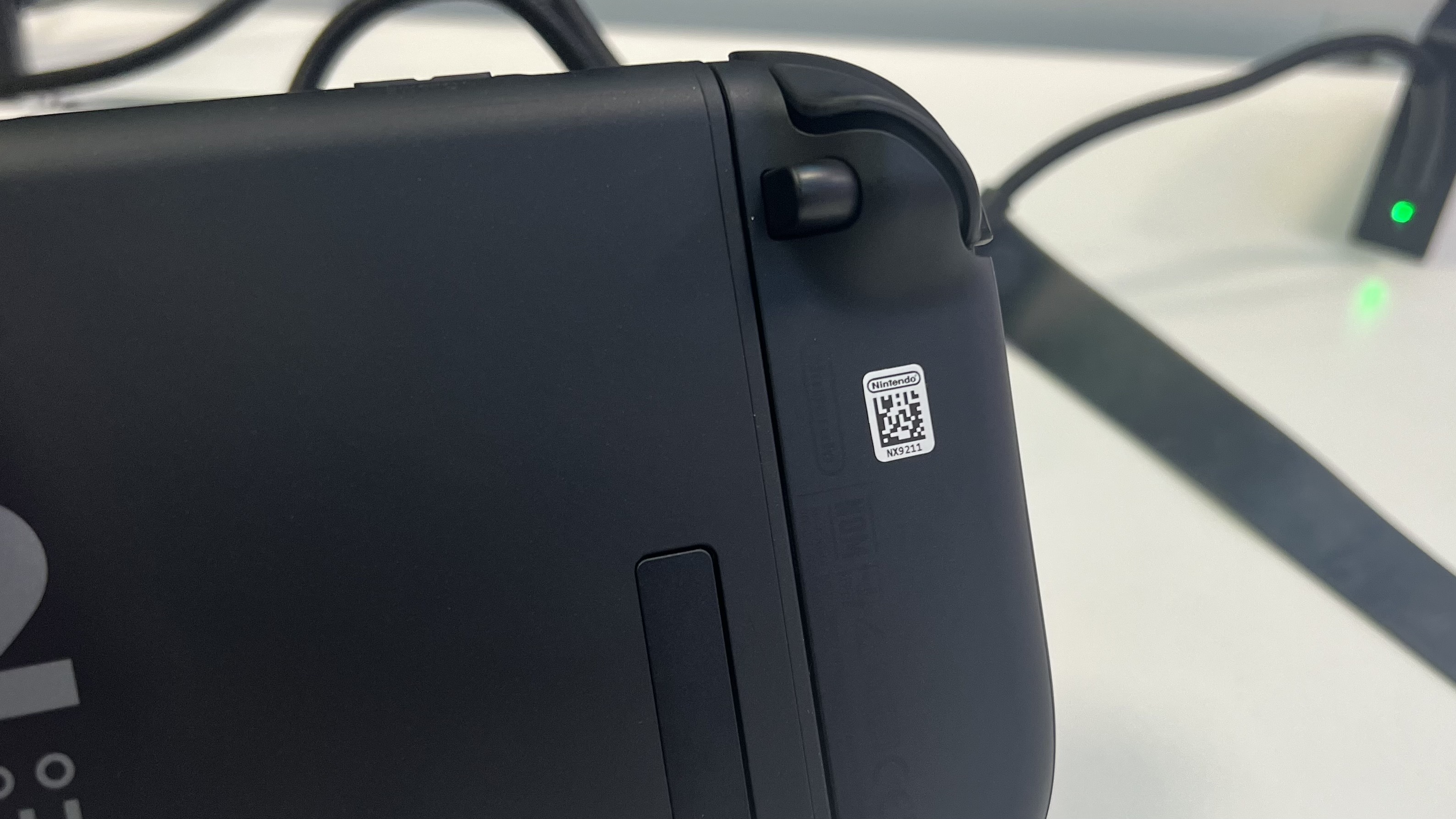 Back of Nintendo Switch 2 handheld with Joy-Con detachment button and matte finish on show