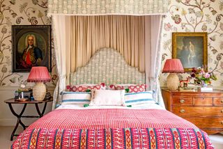 Bedroom with patterned fabrics and wallpaper