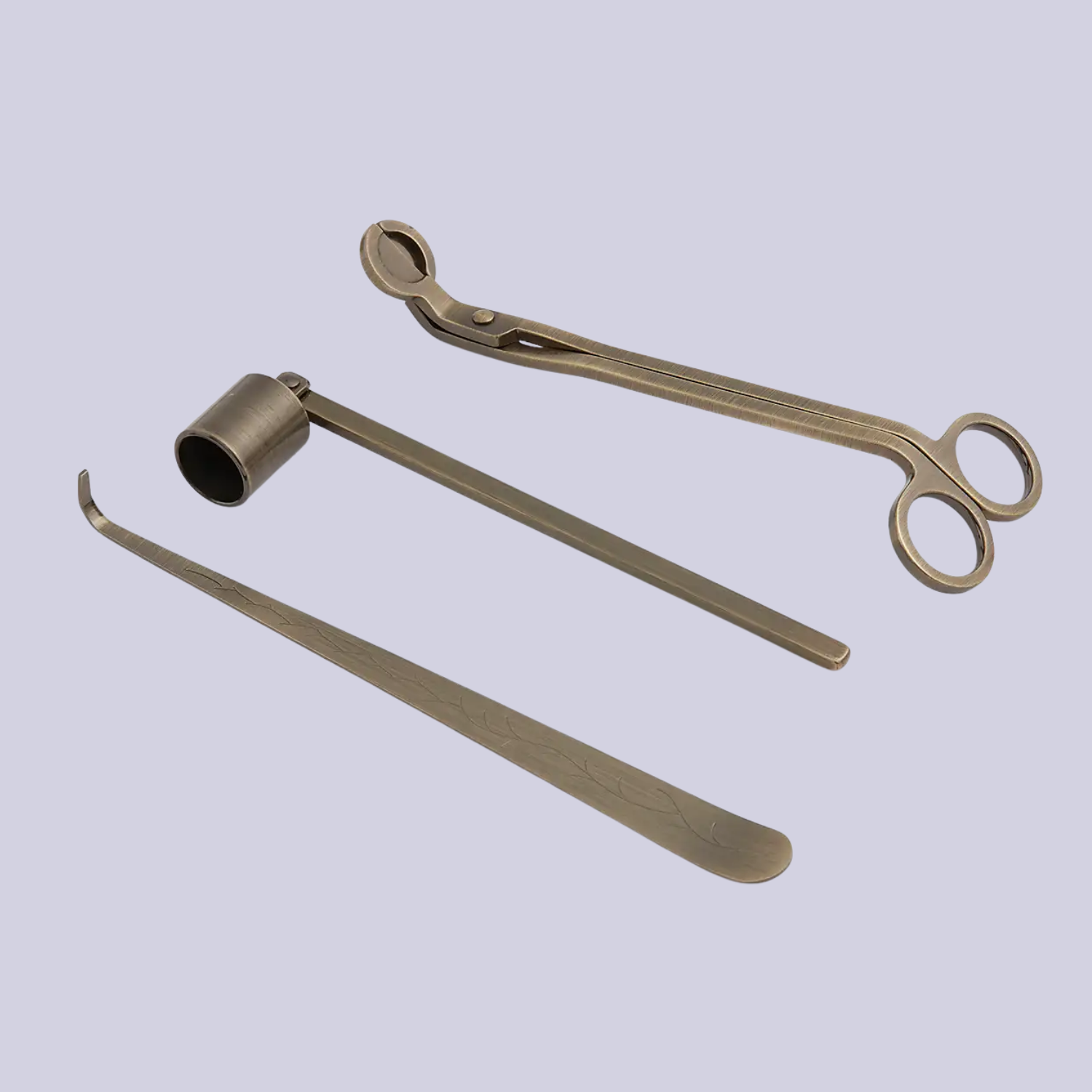 A brass antique candle care set