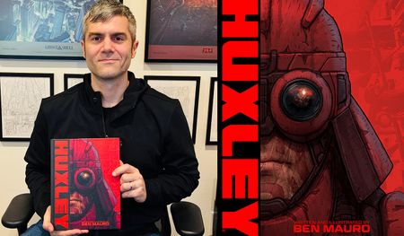 an author holding up his new sci-fi graphic novel
