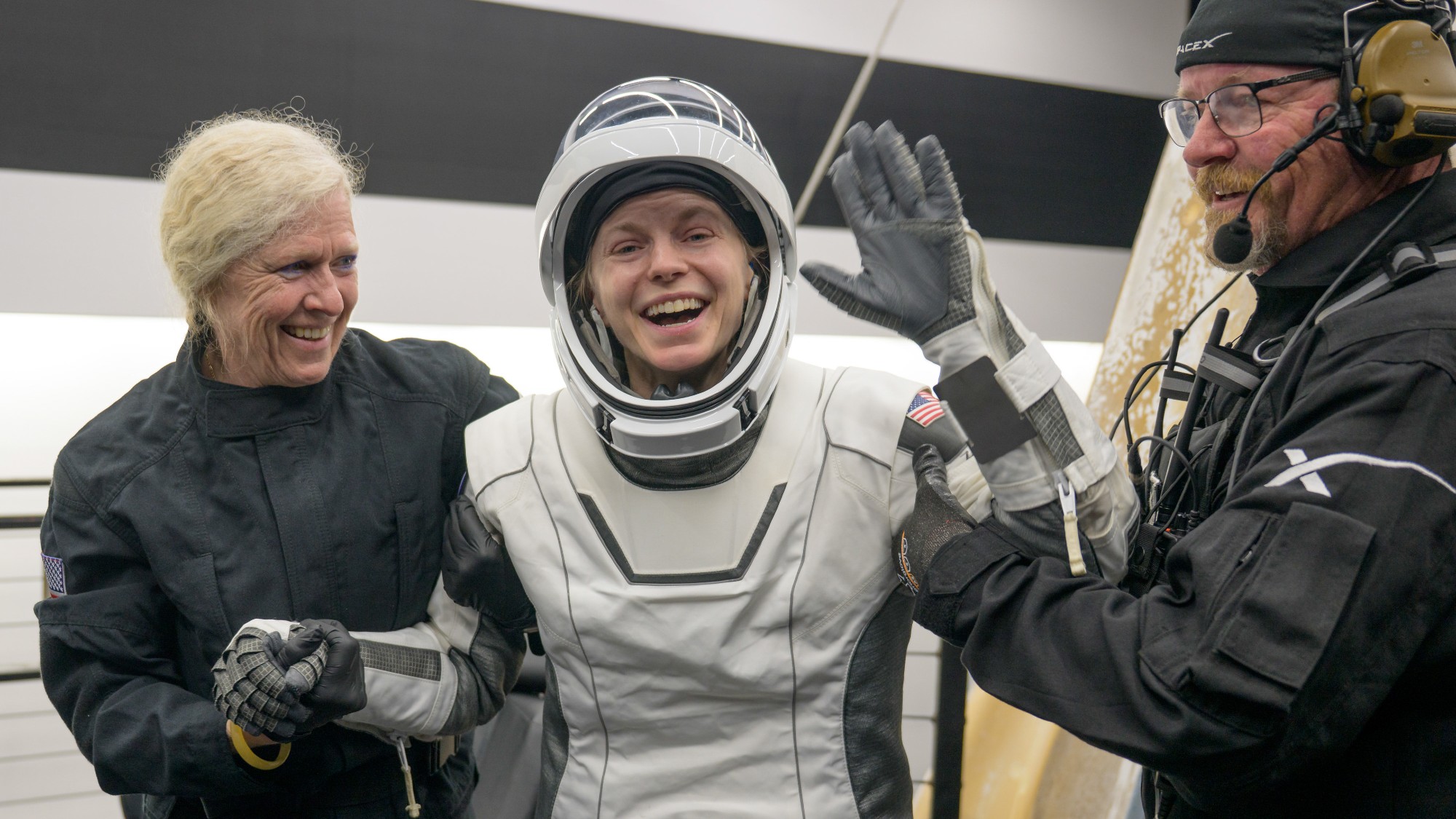 NASA astronaut Zena Cardman is helped out of the SpaceX Dragon Endeavour spacecraft onboard the SpaceX recovery ship SHANNON