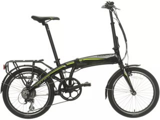 A small green and black folding bike with upright handle bars and 20 inch wheels