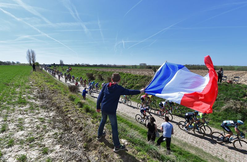 A young French fan flies his flag