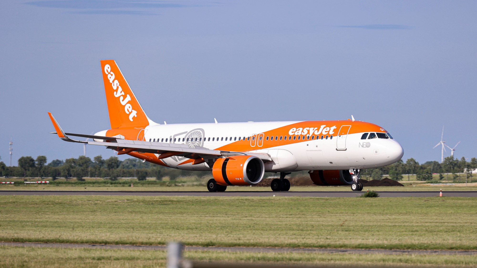 EasyJet plane landing on a runway in Amsterdam