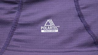 A close up of the Polartec power grid logo on the lower front right hand side of the base layer
