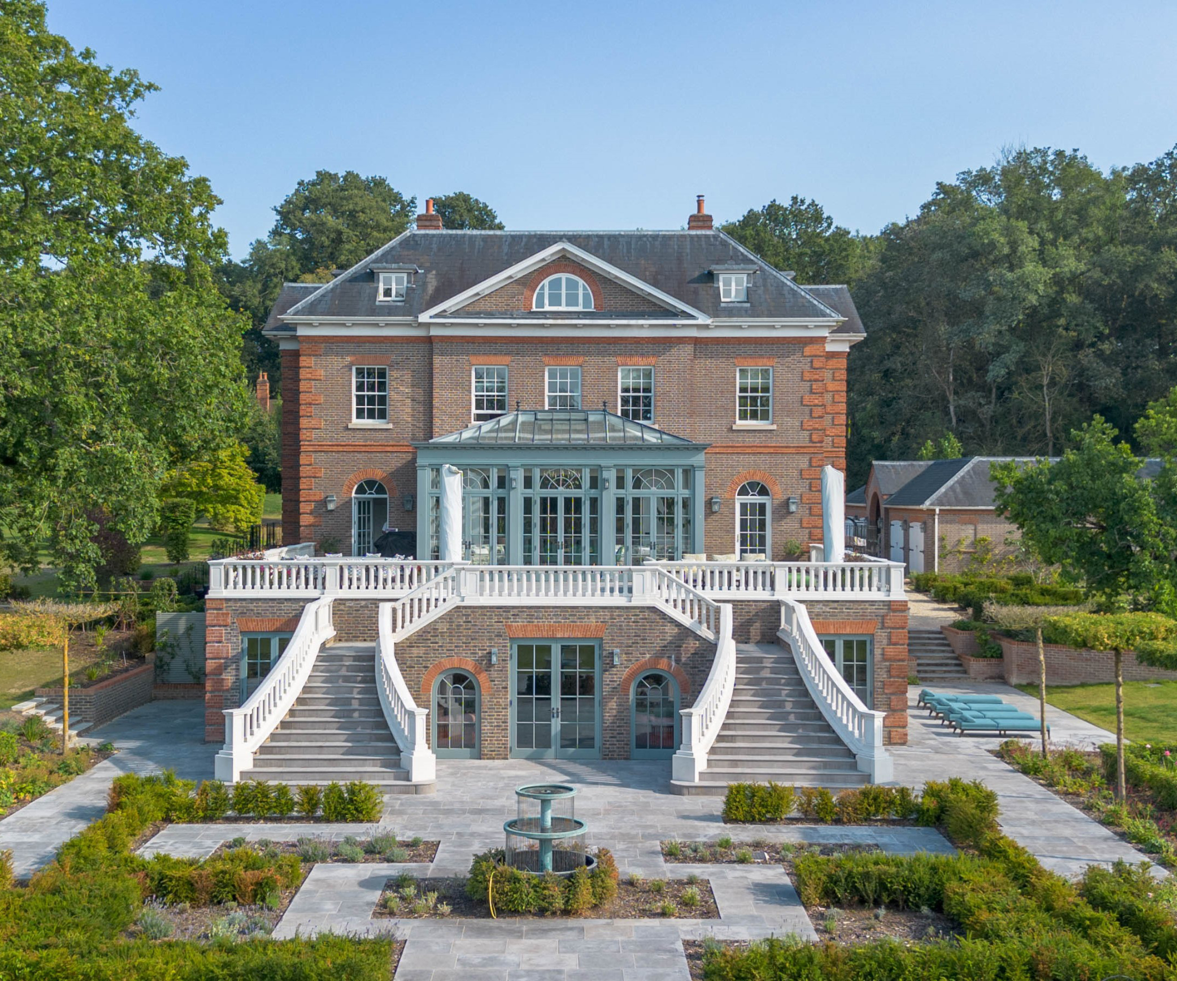 large country property with orangery located at first floor level on terrace accessed via staircases to either side from garden