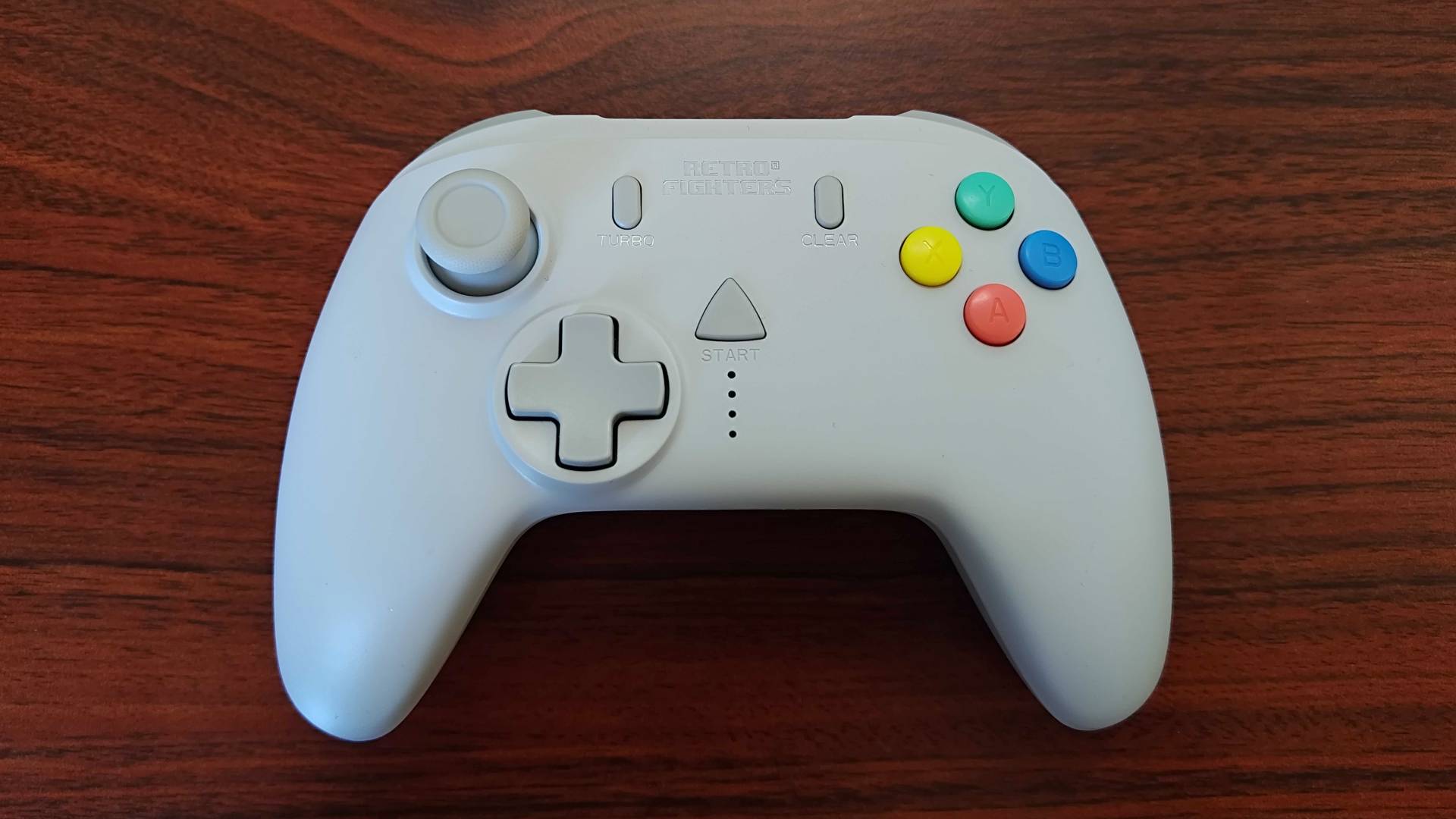 Front view of Retro Fighters StrikerDC on woodgrain desk.