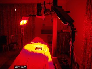 The imaging system illuminates an ancient Egyptian coffin lid with a red-light wavelength.