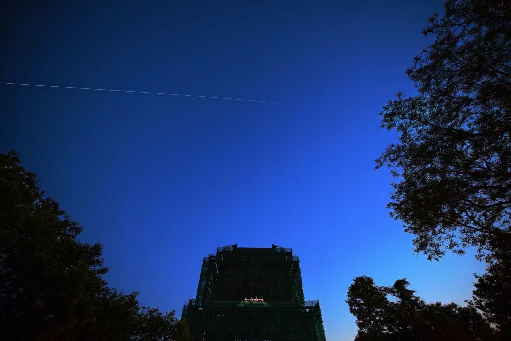 China&#039;s space station core module &#039;Tianhe&#039; flies over the Bell Tower on May 2, 2021 in Beijing, China. 