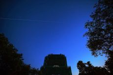 China's space station core module 'Tianhe' flies over the Bell Tower on May 2, 2021 in Beijing, China. 