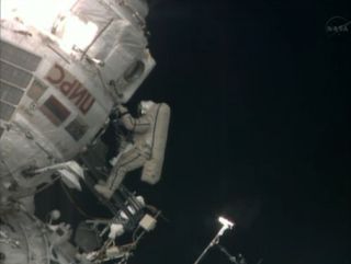 Russian cosmonaut Pavel Vinogradov, the world's oldest spacewalker, floats outside the International Space Station near the end of a 6.5-hour spacewalk on April 19, 2013.