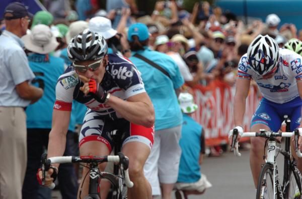 Andre Greipel rolls over the line. Unsure whether he's won or not.