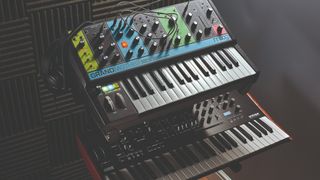 Moog and Korg synths in a studio