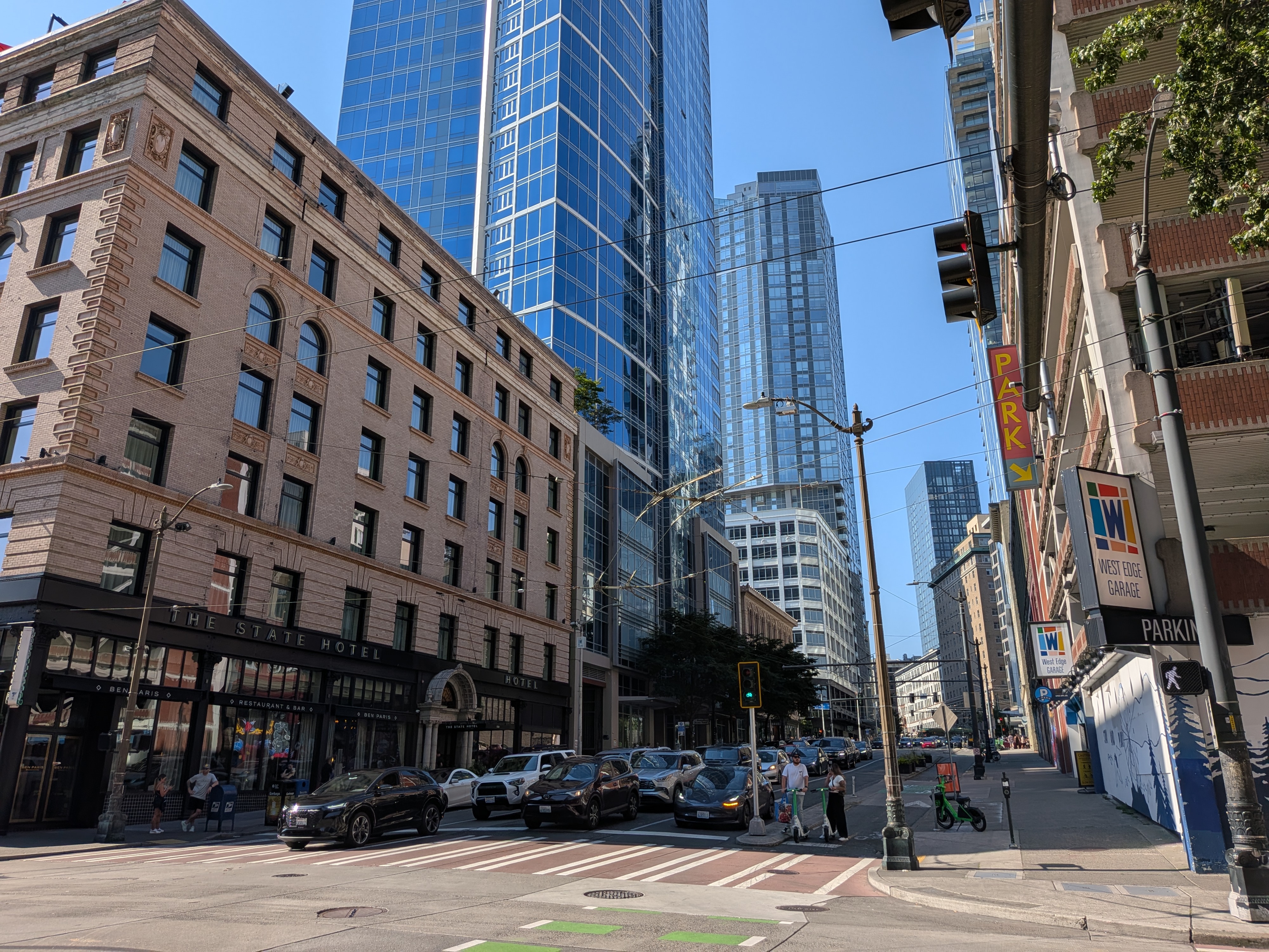 A street with cars and buildings on either side