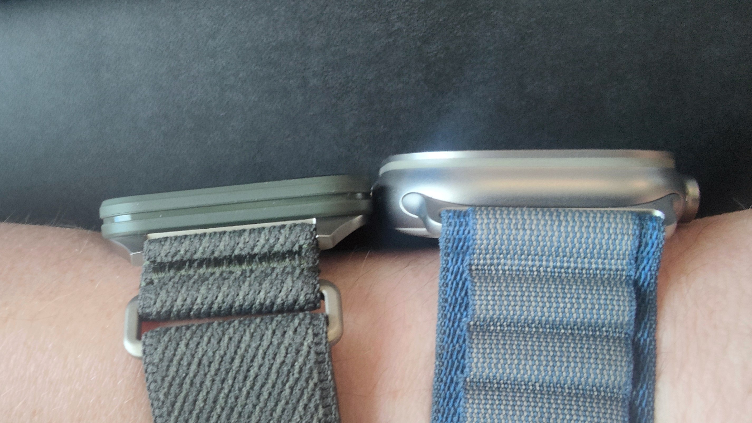 Garmin Venu X1 on wrist alongside Apple Watch Ultra 2