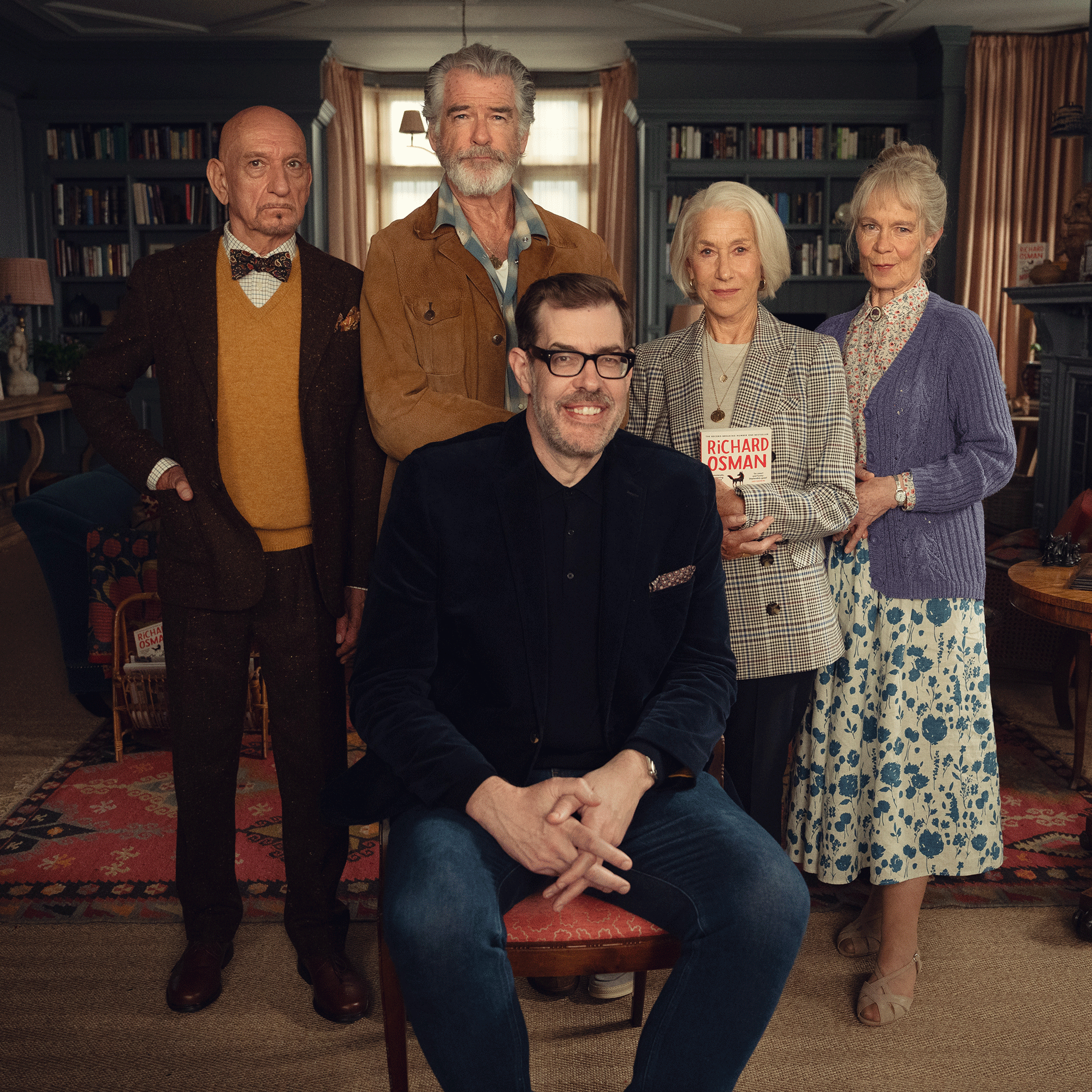 Thursday Murder Club cast on set in blue room with Richard Osman