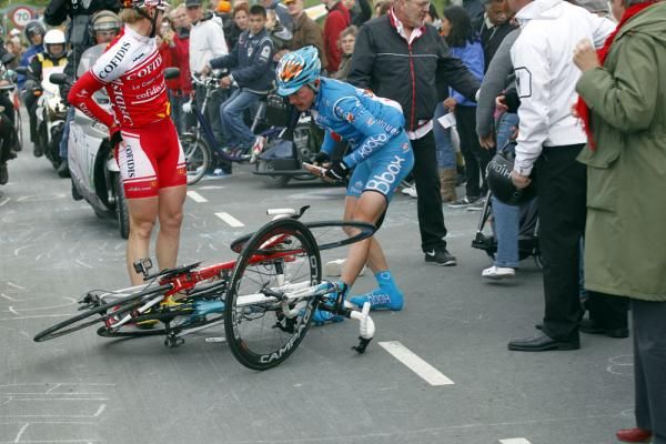 Riders prepare to untangle their bikes after a crash