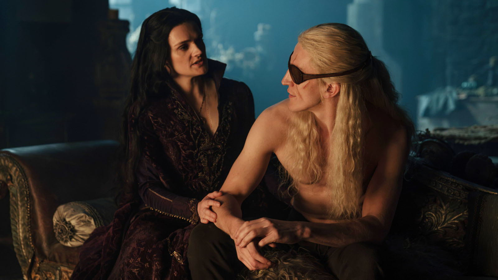 Alys and Aemond looking at each other in a dark room lit with candlelight in House of the Dragon season 3 episode 6