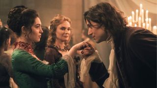 Gercourt kisses Isabelle's hand as Rosamonde looks on