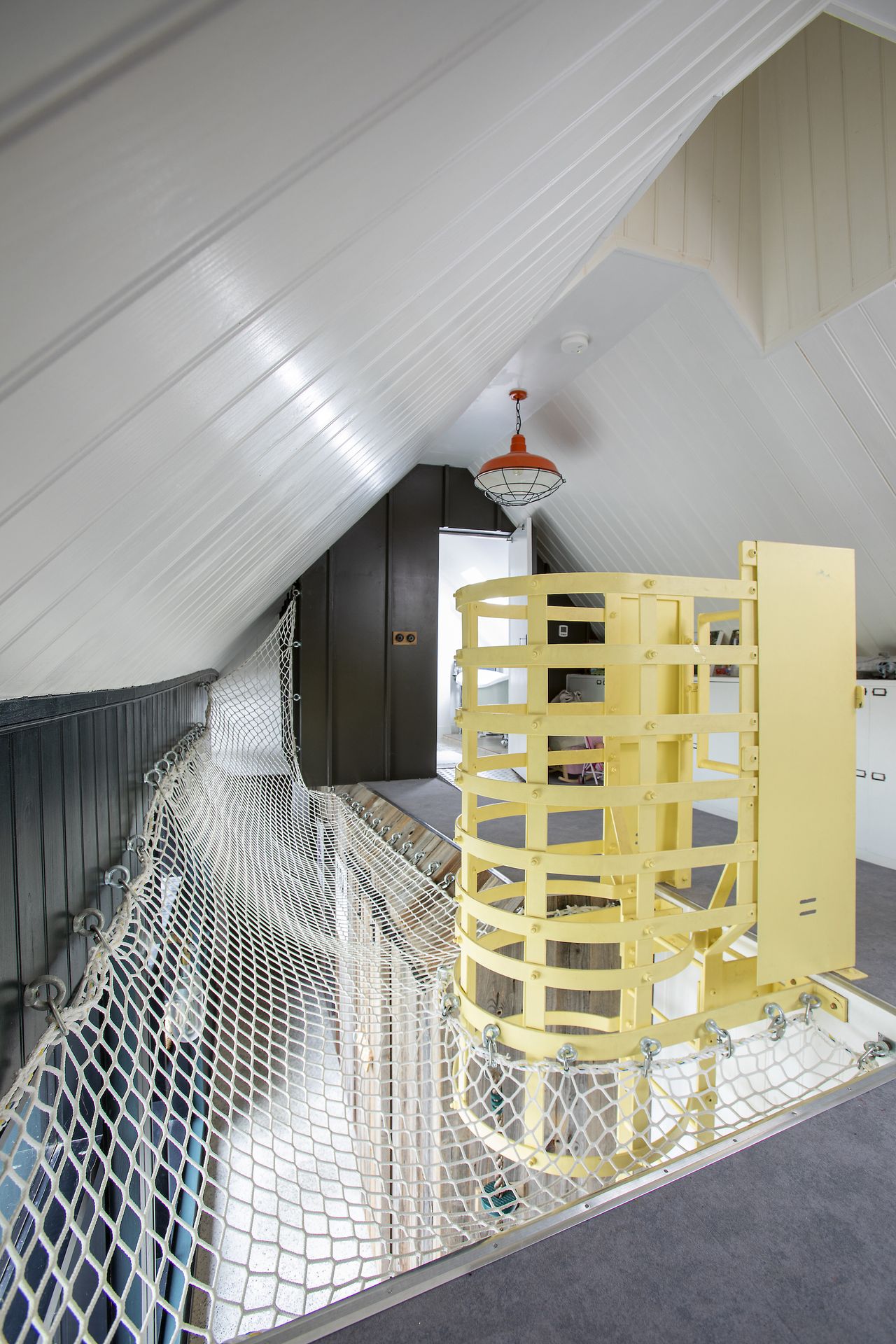 landing with netting and yellow ladder