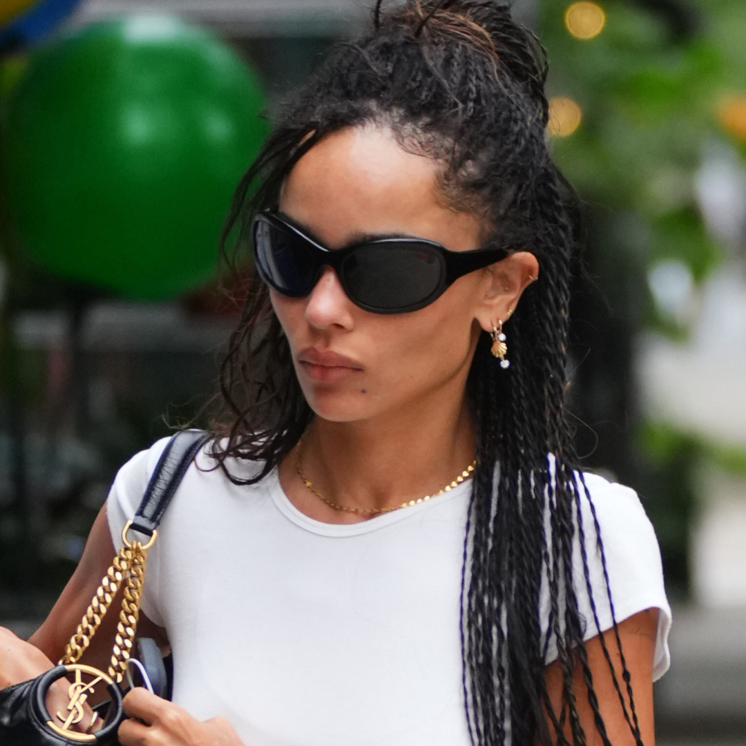 Zoe Kravitz wears the ballet flats trend with distressed jeans and white T-shirt on August 22, 2026 in New York City