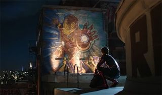 Peter looking up at an Iron Man mural