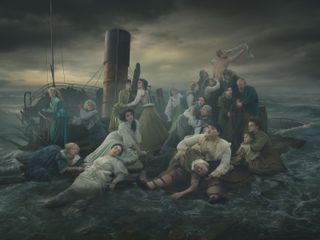 People sit on the bank of the Thames after what appears to be a shipwreck