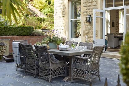  Sims Hilditch family home outdoor dining area with wicker chairs
