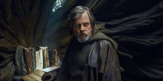 Luke with the ancient Jedi text