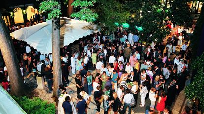 Crowd of people at a past Venice Biennale: In preparation for the Venice Architecture Biennale 2023, we revisit the US Pavilion's celebrations at the Peggy Guggenheim Collection museum during the 2008 festival, as reported in Wallpaper's December issue of the same year