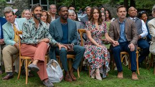 L-R: Claude (Marco Calvani), Danny (Colman Domingo), Kate (Tina Fey) and Jack (Will Forte) sitting in the front row of a crow in a scene from Netflix's "The Four Seasons".