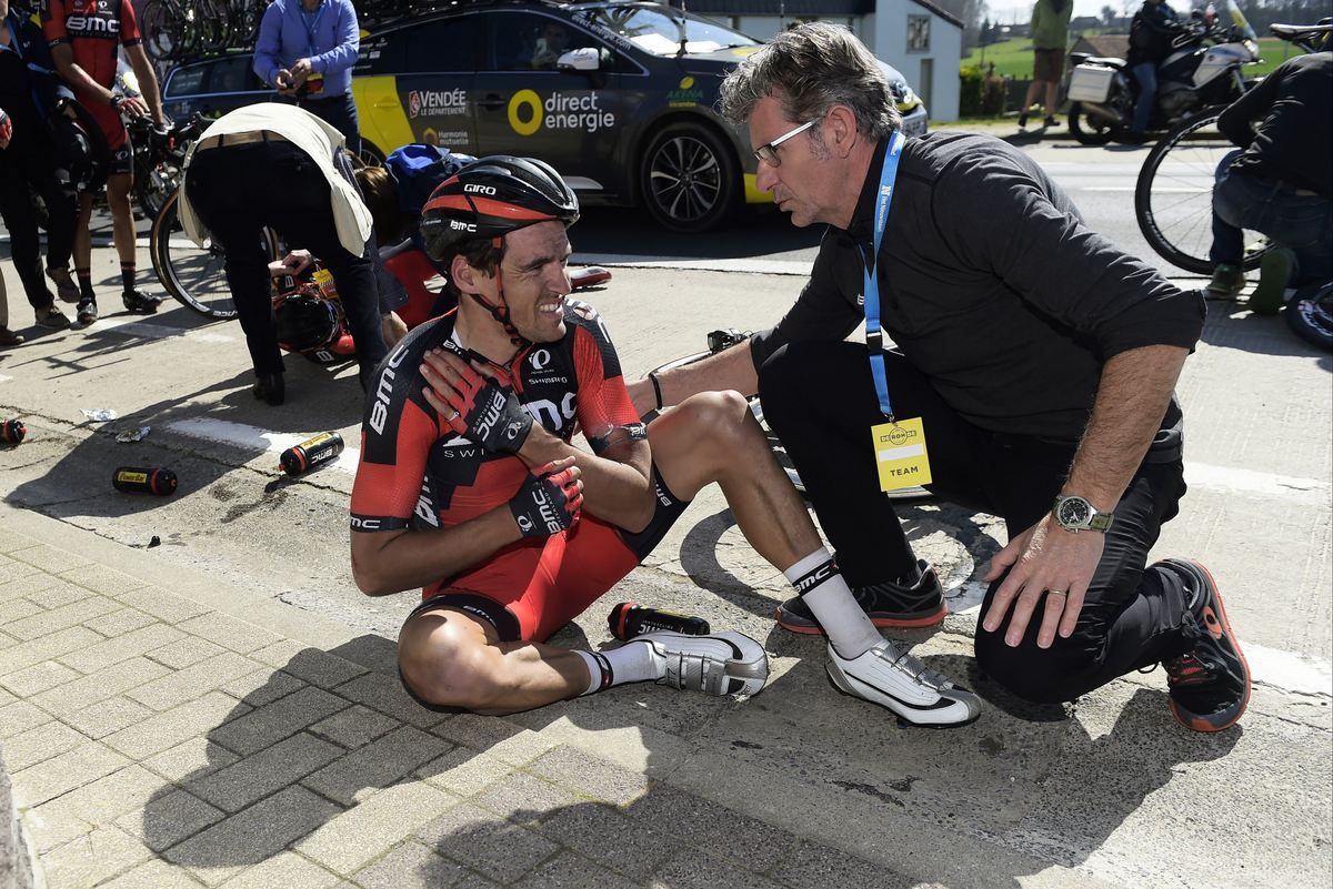 Greg Van Avermaet holds his left collarbone after crashing