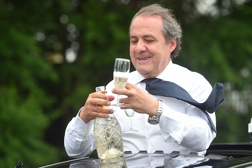 Race director Mauro Vegni joins in the celebrations