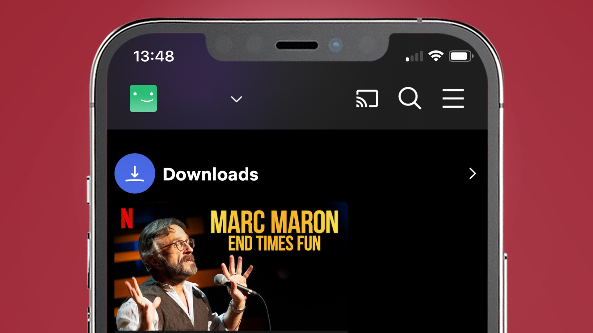 An iPhone on a red background showing the Netflix app