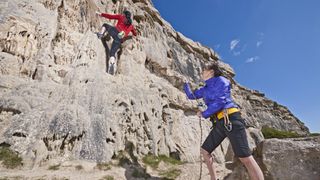 A guide to climbing ratings: climbers on a wall