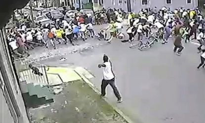 The suspect (bottom center) who opened fire at a Mother's Day parade, in New Orleans, May 12.