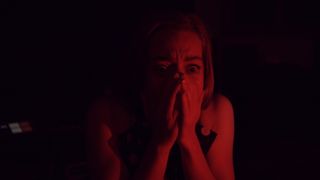 How to make an FMV game; a woman in red lighting