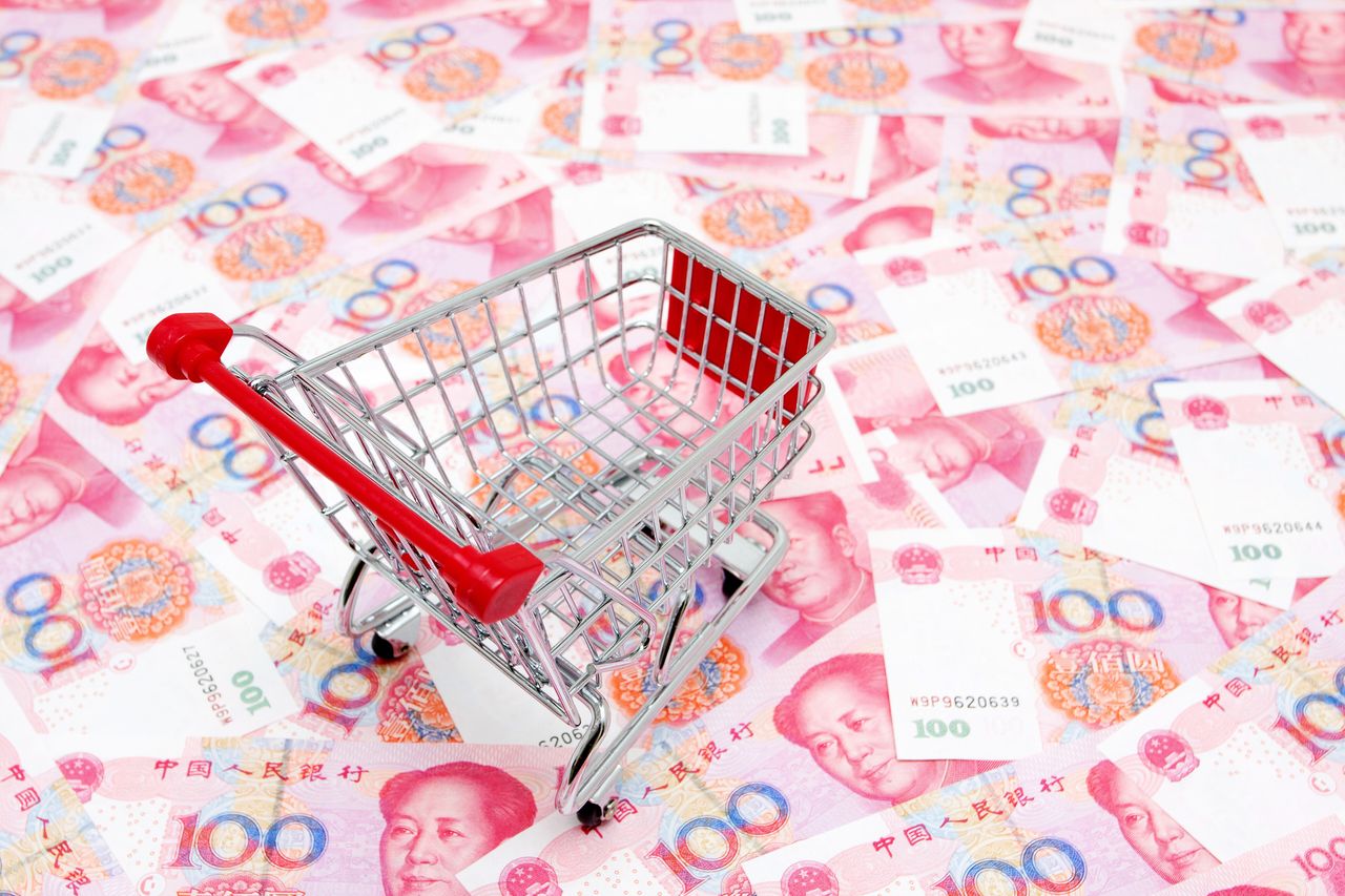 Empty shopping Cart on the Chinese Yuan background consumption concept