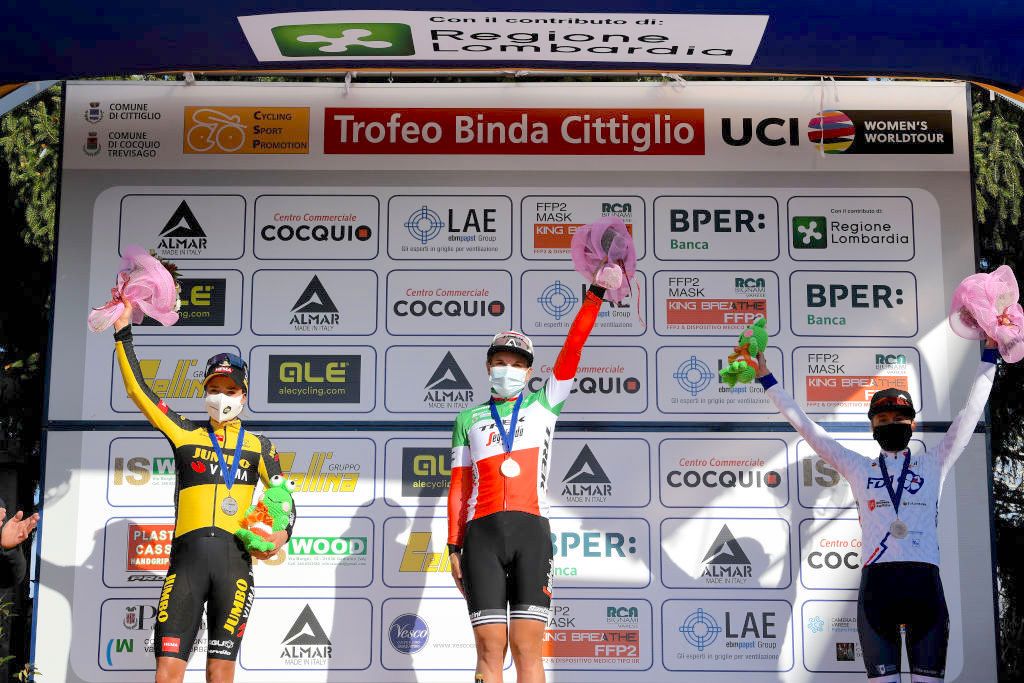 CITTIGLIO, ITALY - MARCH 21: Podium / Marianne Vos of Netherlands and Team Jumbo Visma, Elisa Longo Borghini of Italy and Team Trek - Segafredo &amp; Cecilie Uttrup Ludwig of Denmark and Team FDJ Nouvelle - Aquitaine Futuroscope Celebration, during the 45th Trofeo Alfredo Binda-Comune di Cittiglio 2021, Women's Elite a 141,8km stage from Cocquio Trevisago to Cittiglio 257m / Mask / Covid safety measures / Medals / Flowers / #TrBinda / #UCIWWT / on March 21, 2021 in Cittiglio, Italy. (Photo by Tim de Waele/Getty Images)