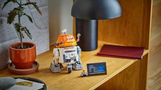 Lego Chopper on display on a side table, beside a plaque and minifigure version of the droid