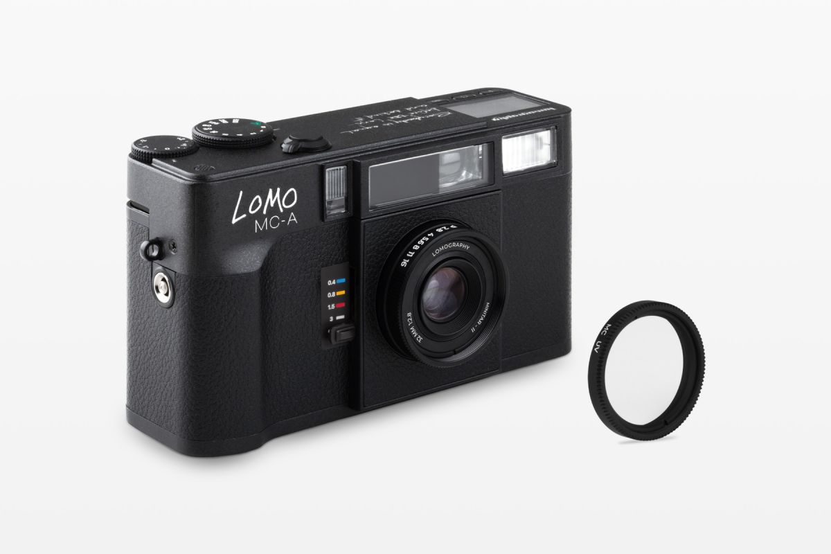 Lomography Lomo MC-A point-and-shoot 35mm film camera on a white background