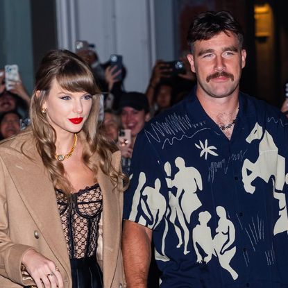 Taylor Swift holds hands with Travis Kelce