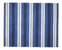 A blue and white striped outdoor rug