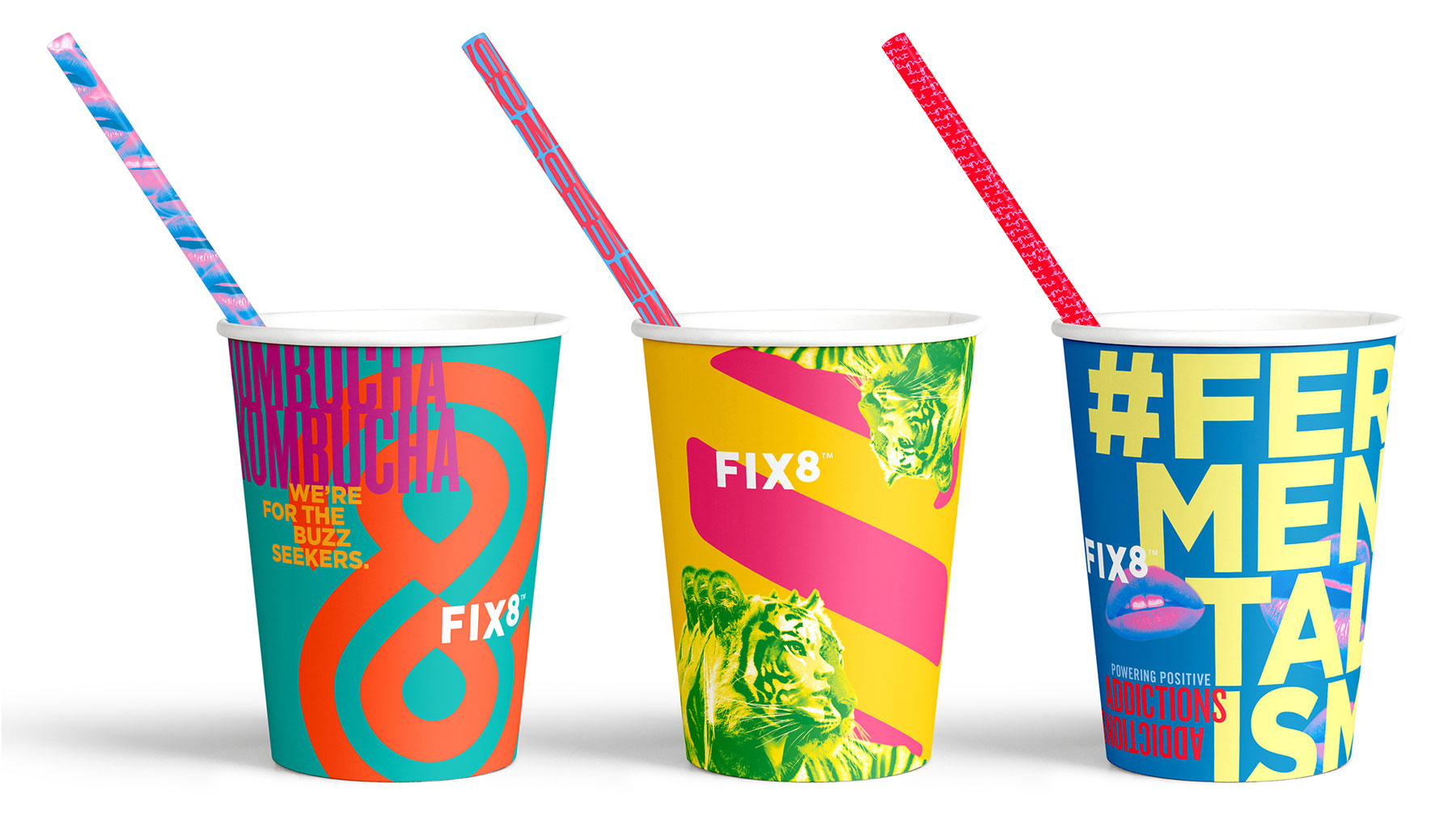 three brightly coloured cups with straws