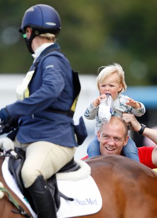 Mike Tindall and daughter Mia cheer on Zara as she competes in an equestrian event