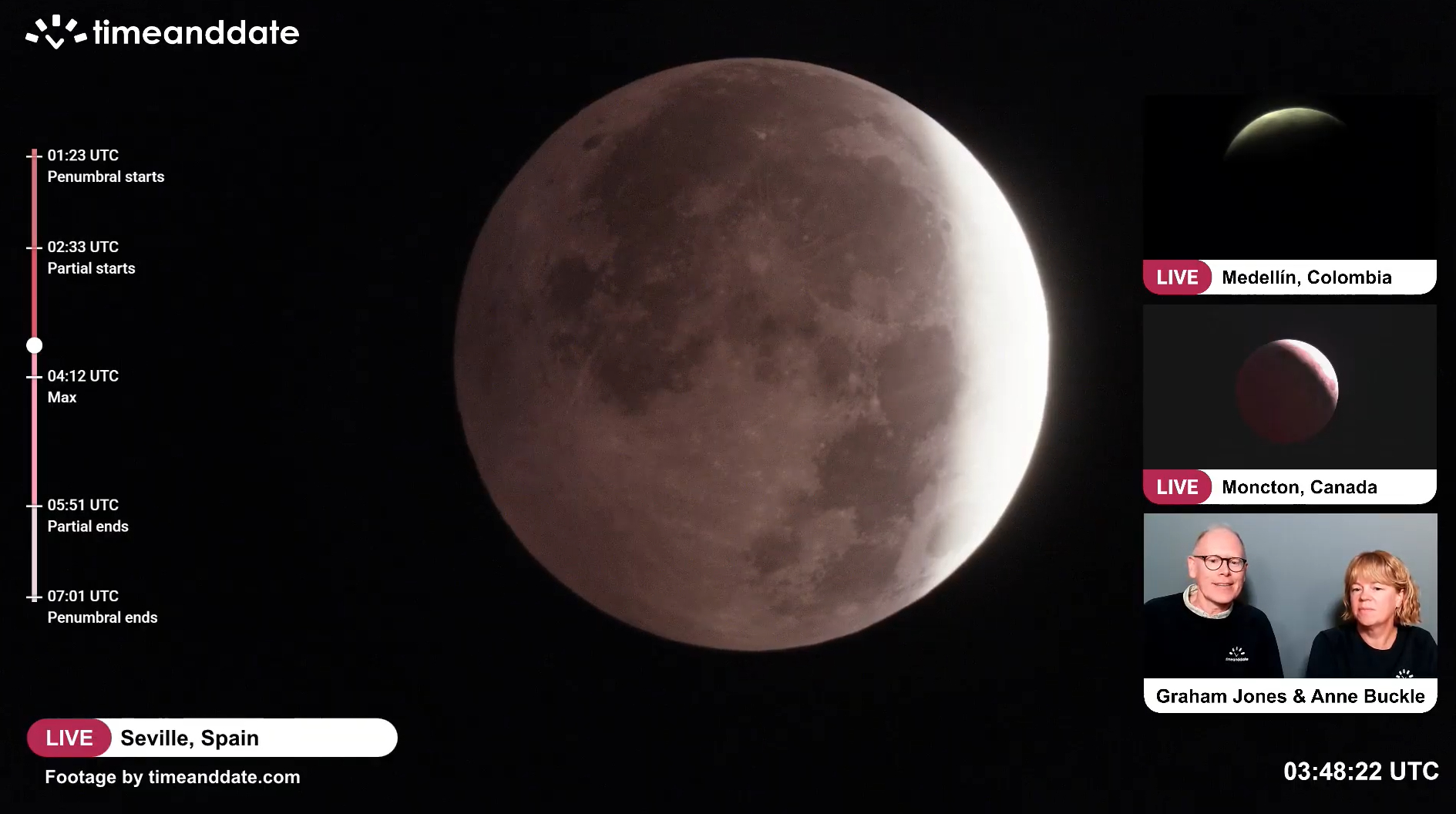 close up view of the moon in the night sky with a darker region to the upper left - the umbra has started moving onto the moon..