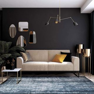 70s trends: off-white couch in living room with black wall