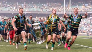 Fraser Dingwall, Fin Smith and Henry Pollock of Northampton Saints celebrate winning the Gallagher PREM Rugby title on June 20, 2026
