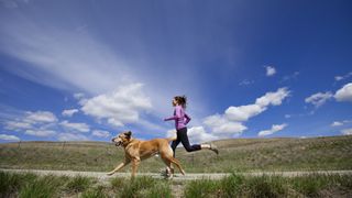 Lady running with her dog